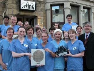 Taylor, Redfearn & crew with their awards, being visted by Gordon Prentice, MP at their surgery on Scotland Road, Nelson.